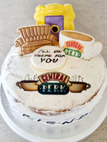 Load image into Gallery viewer, Friends Theme Cake . 8inch vanilla sponge with DF cream and strawberry jam. Cookie toppers.
