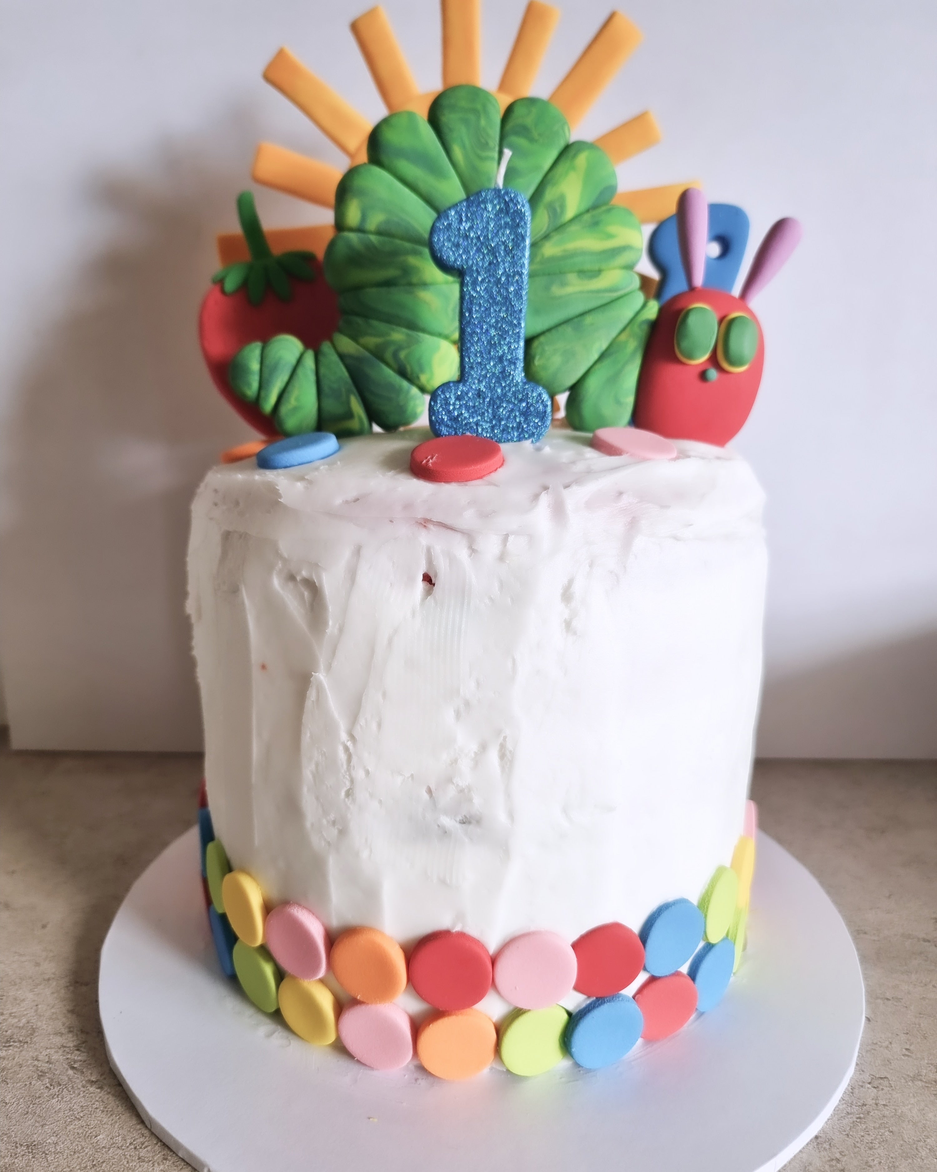 The Hungry Caterpillar 8inch. Rainbow colours inside. Vanilla Sponge with DF buttercream. 5 layers 